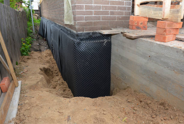 Happy homeowners after waterproofing job in New London